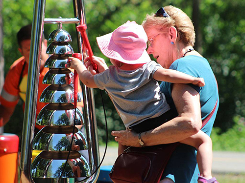 Newsletter 1 - Grandma & Baby Playing Bell Lyre