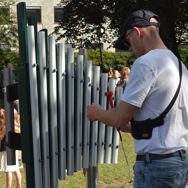 Man Playing Outdoor Xylophone in Park