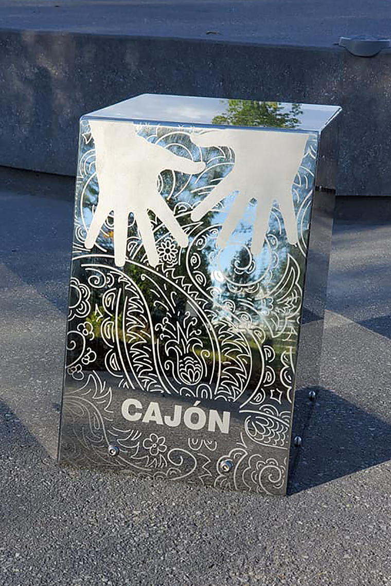 a stainless steel outdoor cajon drum in the Quinterra Legacy Musical Memorial Garden