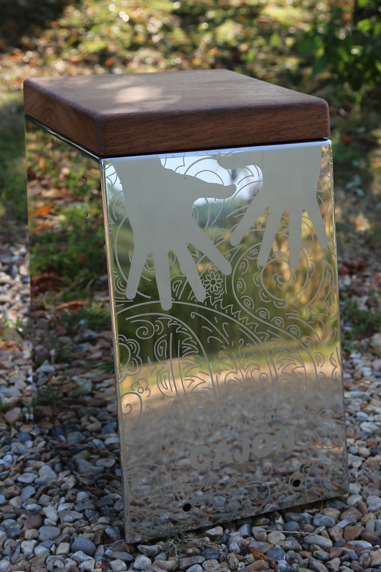 a stainless steel outdoor cajon drum with a wooden seat for musical parks and playgrounds