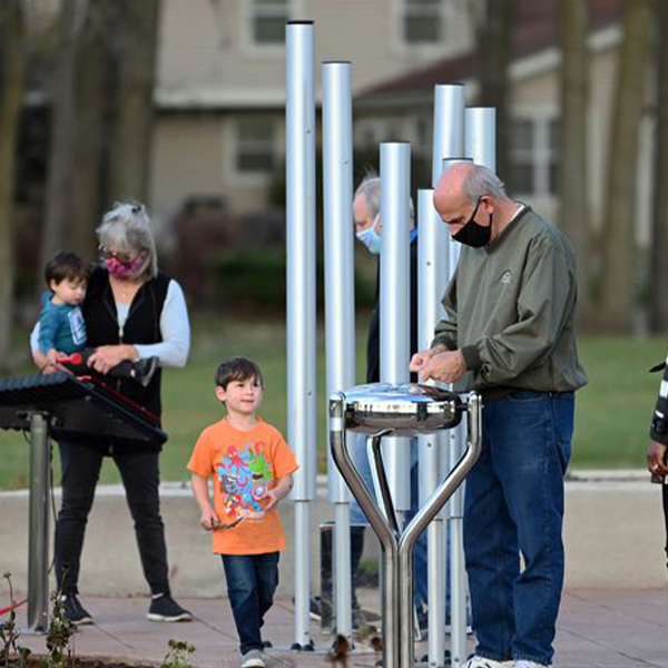 Blog - Family Playing Babel Drum (Masked)