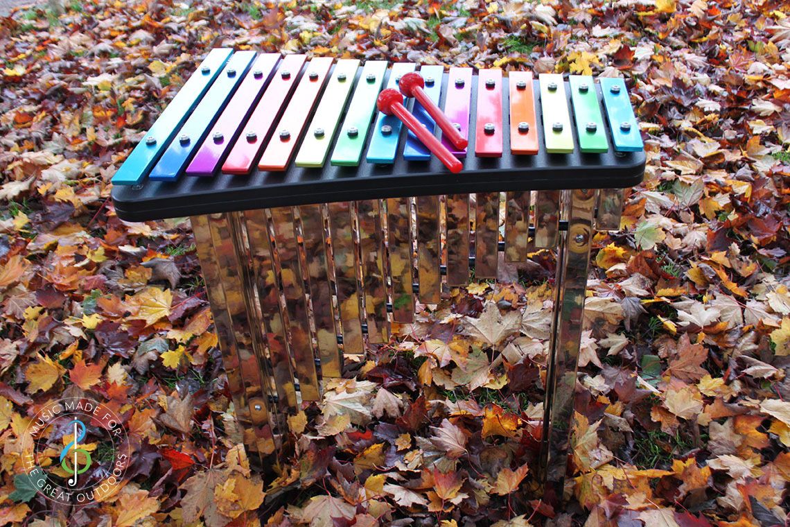 Rainbow Coloured Outdoor Xylophone in Park in Autumn