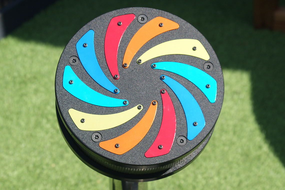 A small rain wheel with rainbow colored flashes in an early years setting